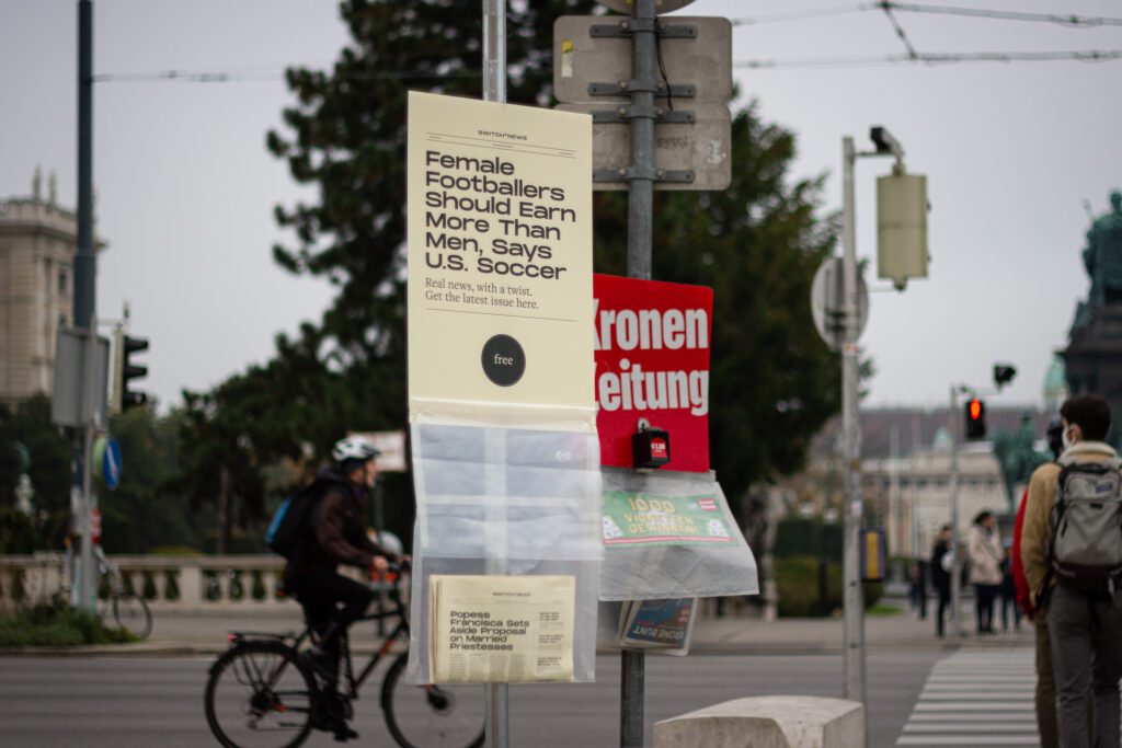 Self-service newspaper stand in public space