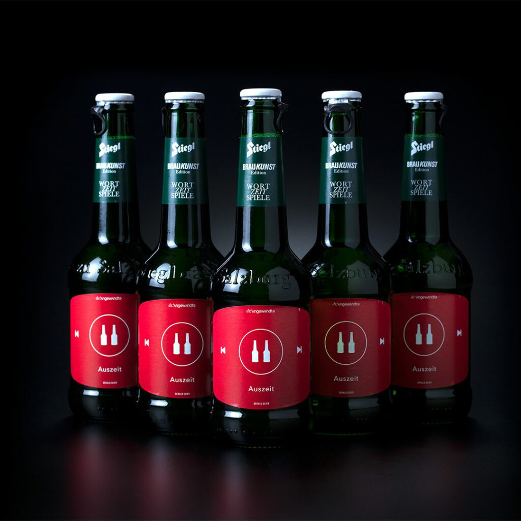 Packshot of beer bottles with red label